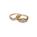 A 9 carat gold diamond wishbone ring, the round brilliant cut diamonds, in white claw settings, to a