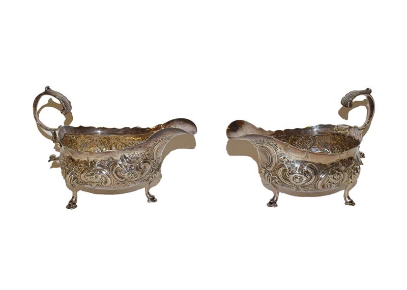 A pair of George III silver sauceboats, by William Sumner, London, 1785, each on three pad feet