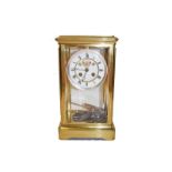 A brass four glass striking mantle clock, circa 1890, 31cm high with twin tube mercury pendulum