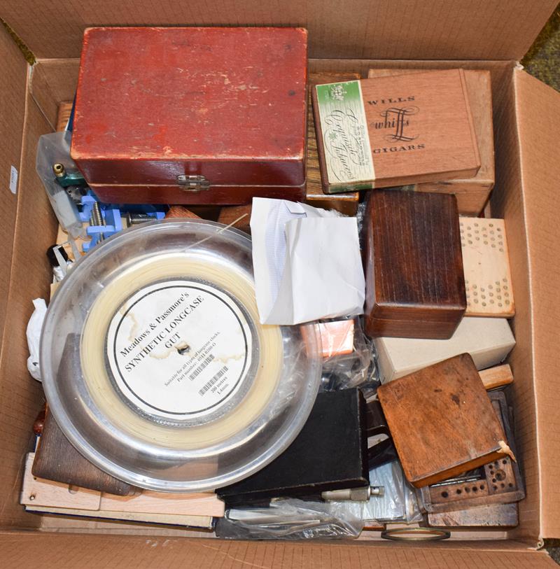 A quantity of watchmakers tools, including staking tool sets, longcase clock hands, carriage clock