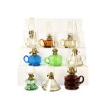 A Victorian brass based oil lamp with associated Vaseline glass shade, a Mary Gregory style glass