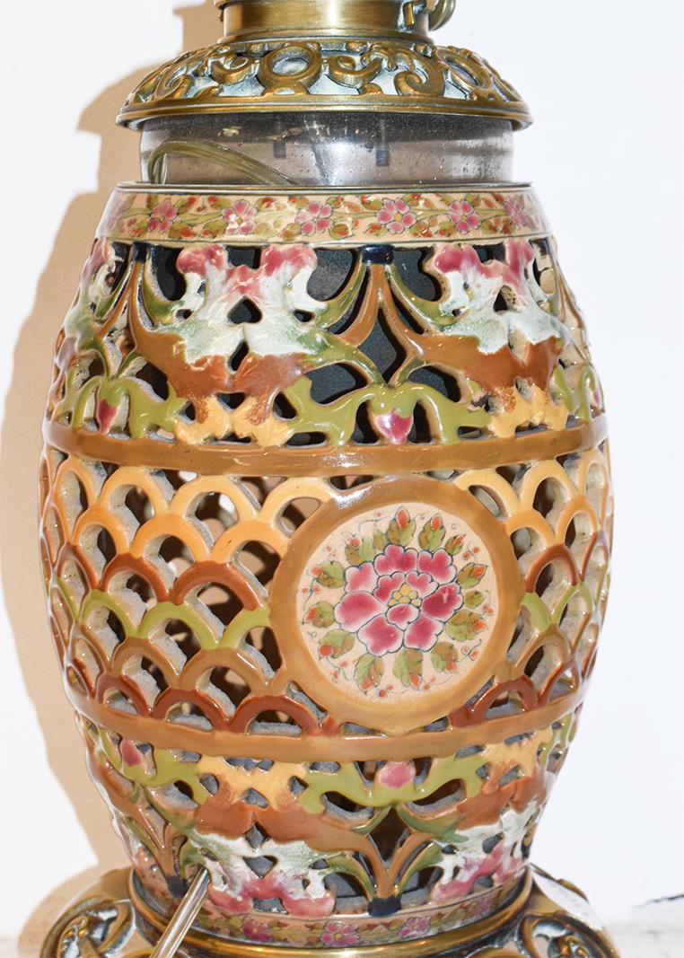 A reticulated pottery based oil lamp, probably Zsolnay, a cut glass table lamp, a large lamp with - Image 8 of 12