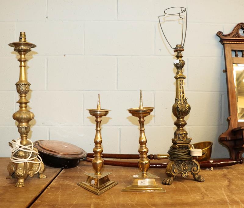 A pair of 19th century brass candle prickets, two other metal table lamp bases, a copper warming pan