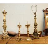 A pair of 19th century brass candle prickets, two other metal table lamp bases, a copper warming pan