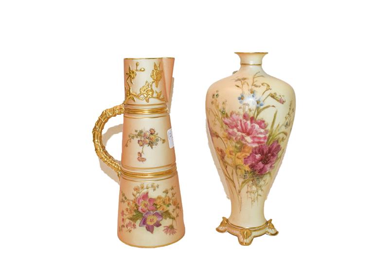 A 19th century Royal Worcester tusk jug painted with flowers on a peach ground with a gilded back