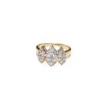 A diamond triple cluster ring, the graduated kite shaped clusters set throughout with round