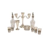 A collection of assorted silver, including a three-light candelabra, a dressing table box, vase, two