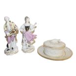 A pair of German porcelain figures in the Meissen style, a Royal Worcester ivory porcelain butter