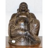 A 19th century carved wooden Buddha, 40cm high