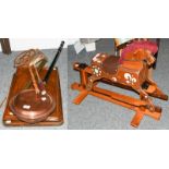 A Victorian brass garden sprayer, two early 20th century oak bed trays, a carpet beater, a vintage