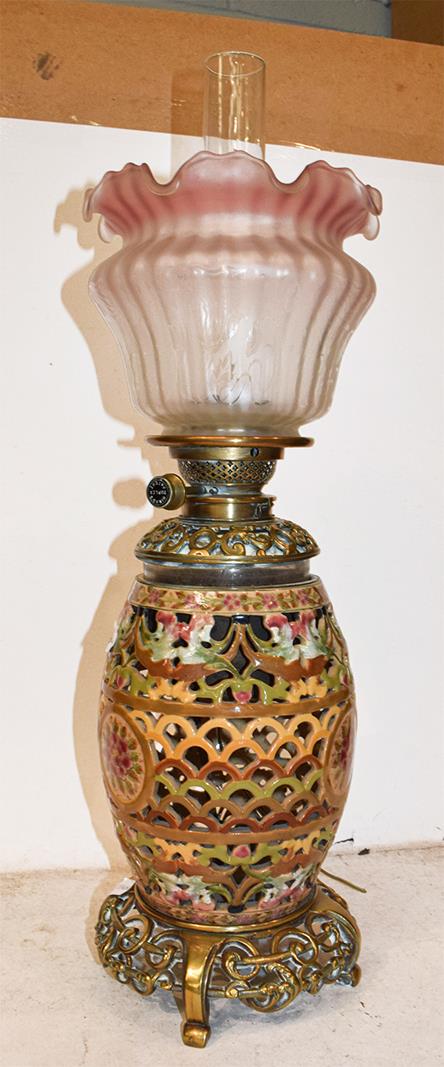 A reticulated pottery based oil lamp, probably Zsolnay, a cut glass table lamp, a large lamp with - Image 4 of 12