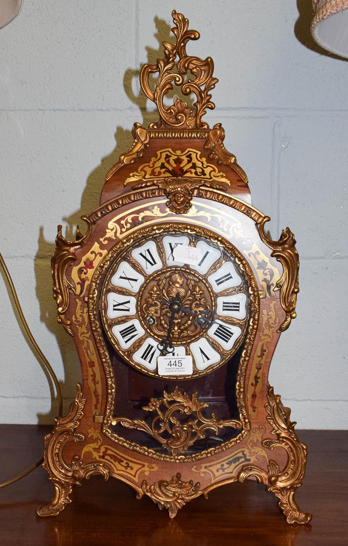 A modern gilt metal mounted boulle type striking table clock