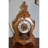 A modern gilt metal mounted boulle type striking table clock