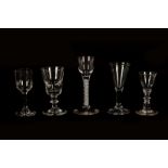 An 18th century cordial glass with latticino stem and four various other drinking glasses (5)