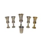 Five various Edward VII or George V silver or silver gilt Kiddush cups, each of typical form,