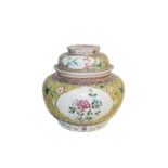 A 19th century Chinese famille rose bowl and cover, yellow ground with lotus scrolls and having