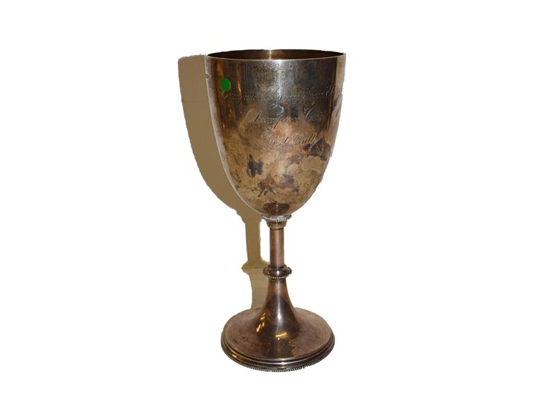 An Edward VII silver goblet, by Mappin and Webb, Sheffield, 1902, the bowl tapering and engraved