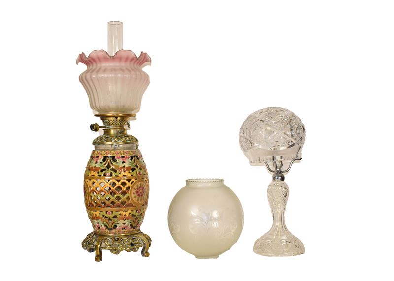 A reticulated pottery based oil lamp, probably Zsolnay, a cut glass table lamp, a large lamp with - Image 2 of 12