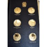 A set of commemorative silver-gilt coins