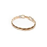 A 9 carat gold bangle, inner measurements 6.4cm by 5.2cm . Gross weight 26.4 grams.