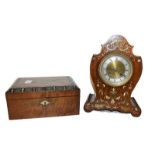 A 19th century French rosewood cased mantel clock with mixed metal inlays, brass and silvered dial