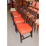 A set of four early 19th century mahogany dining chairs, the back rest with Price of Wales feather