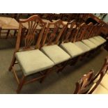 A set of eight Georgian oak Hepplewhite style dining chairs, recently re-upholstered (8)