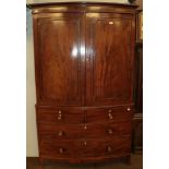 A Regency mahogany bow-front linen press, raised over a three-height chest base over splay bracket