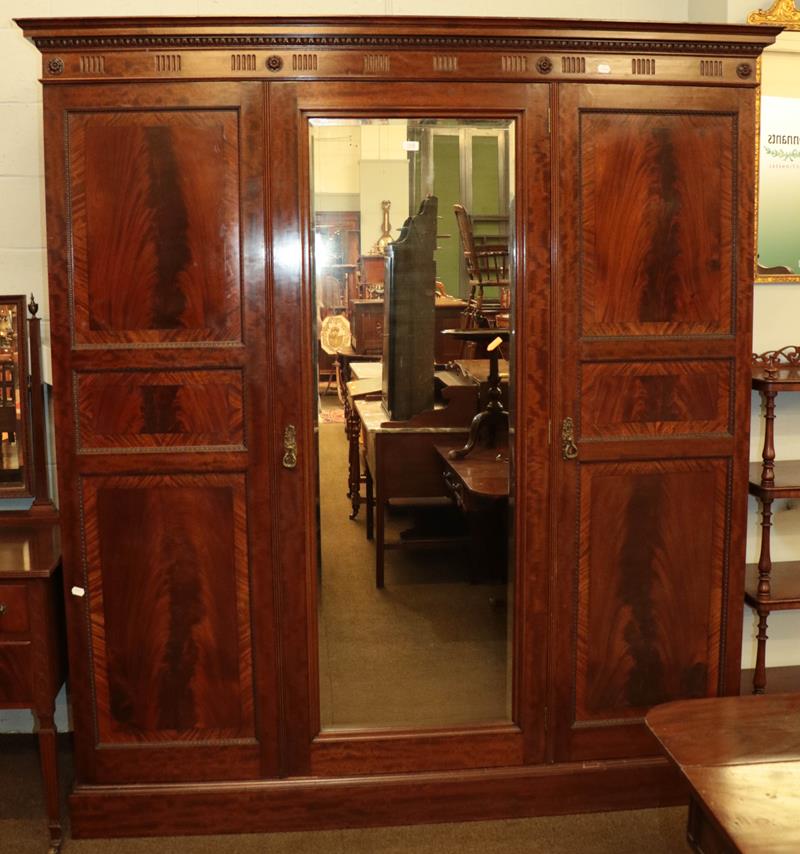 An Edwardian mahogany mirror fronted triple wardrobe, crossbanded and with egg and dart mouldings, - Image 3 of 3