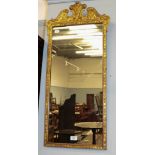 A giltwood and gesso wall mirror with swan neck pediment and Prince of Wales feathers motif, 40cm by