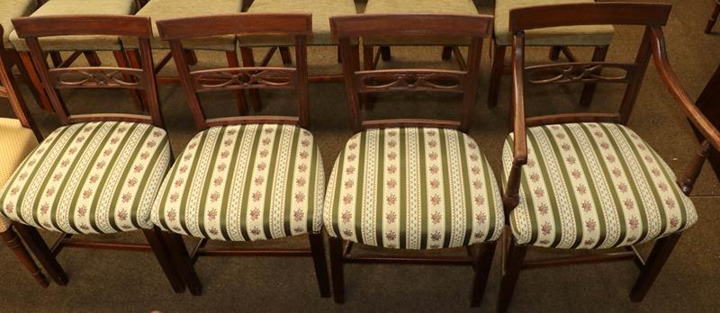 A set of four Regency mahogany dining chairs with reeded mouldings, overstuffed seats and