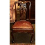 A George II red walnut side chair with pierced baluster shaped splat, raised on plain cabriole