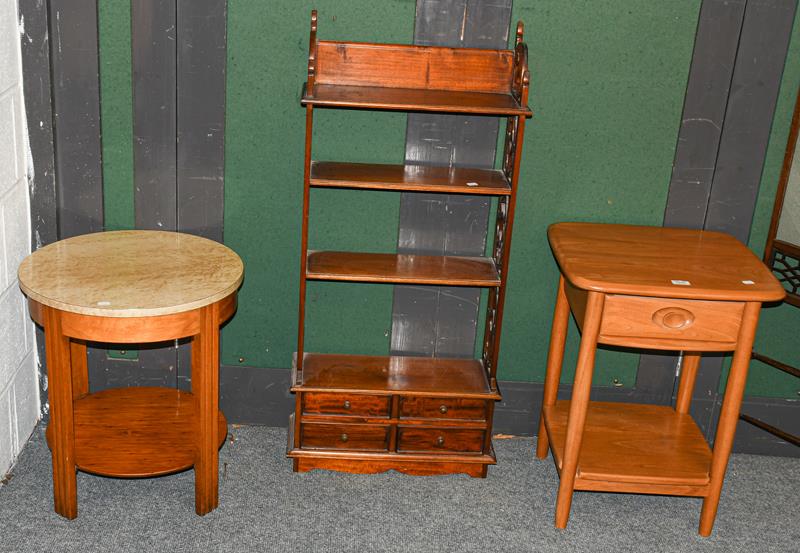 An Ercol blonde oak lamp table, a Goodwill furmica top table and a mahogany fret carved open shelf-