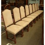 A set of eight 20th century oak dining chairs upholstered in stone suede studded fabric (8)