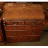 A George III oak bureau with fitted interior, 91cm by 52cm by 97cm