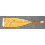 A racing oar, the blade painted Royal York, bearing partial makers label Ayling