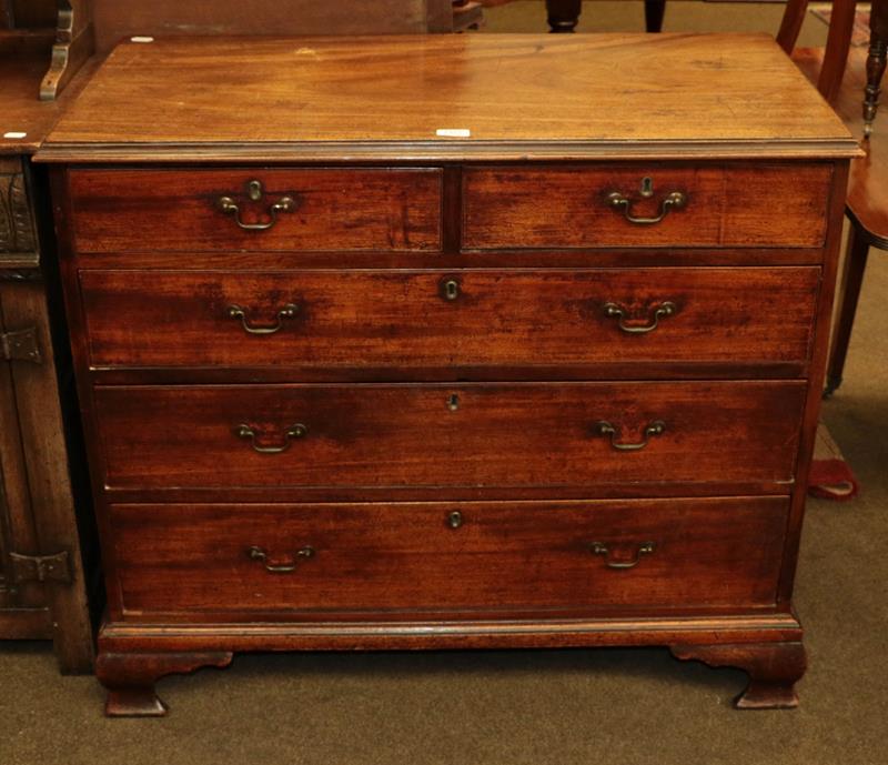 A George III mahogany four-height chest of drawers raised on ogee bracket feet, 98cm by 50cm by