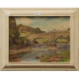 Owen Bowen (1873-1967) A bridge over a river, signed oil on canvas, 29cm by 39cm