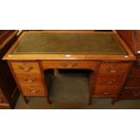 An early 20th century mahogany pedestal desk with green leather top