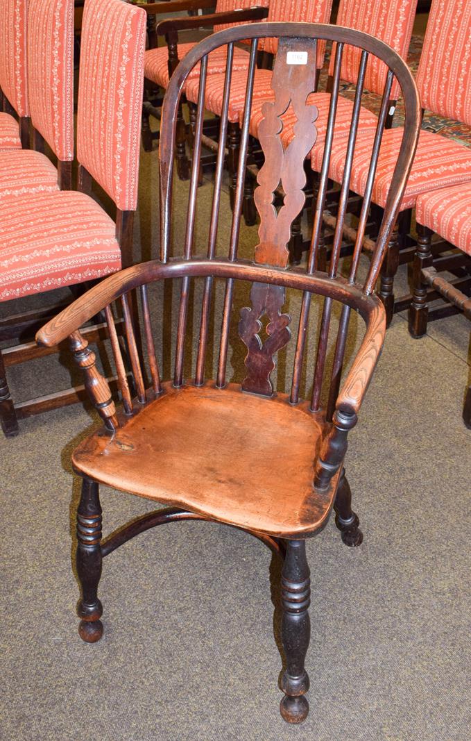 A 19th century ash and elm Windsor armchair with crinoline stretcher