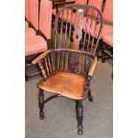 A 19th century ash and elm Windsor armchair with crinoline stretcher