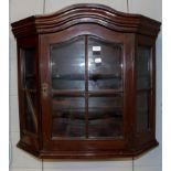 An early 20th century mahogany hanging display cabinet with astrigal glazed doors, 80cm by 33cm by