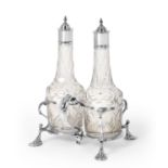 A George III Silver Two-Bottle Cruet, by William Skeen, London, 1774, the shaped stand on four pad