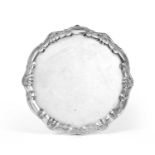 A George II Silver Salver, by William Peaston, London, 1747, shaped circular and on three pad