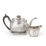 A George III Silver Teapot and Stand and an Associated Cream-Jug, The Teapot and Stand by George