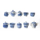 A good collection of early 19th century English pearlware, mainly custard cups, some with covers,