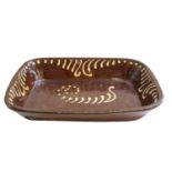 19th century terracotta slipware dish, 39.5cm by 30cmCondition report: Generally good condition