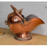 A Victorian copper coal helmet with pivoting handle, engraved with a coronet of a Duke and the