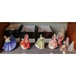A quantity of Royal Doulton figures, some boxed, together with Royal Worcester candle snuffers, etc.