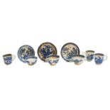 A group of Worcester and Caughley teawares, printed in underglaze blue with Oriental landscapes,